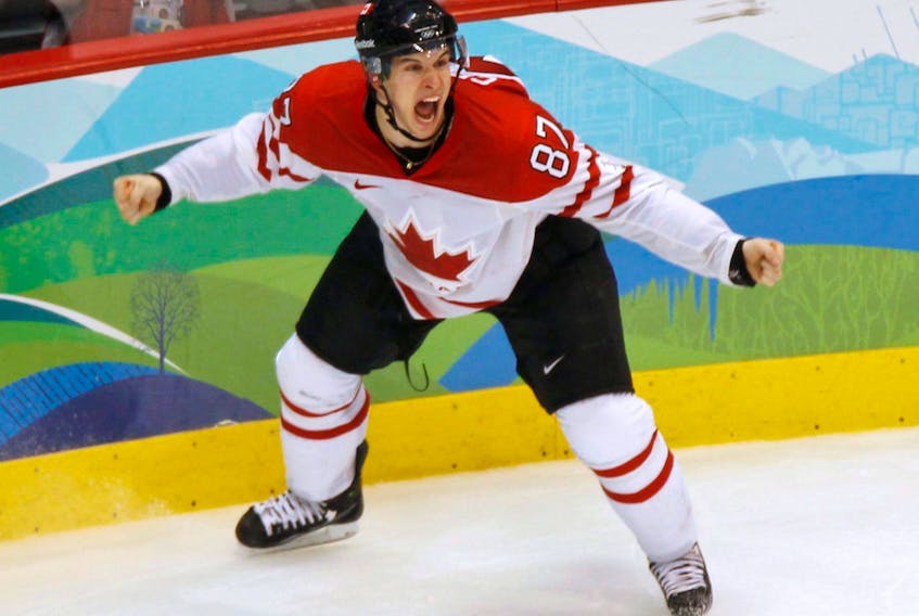 In this Feb, 28, 2010 file photo, Canada’s Sidney Crosby celebrates his game-winning goal in overtime in the men’s hockey gold-medal final in Vancouver. A decade ago, Telegram Sports Editor Robin Short was in Vancouver covering the Winter Olympic Game and got the chance to witness history as Crosby score the “Golden Goal.” — File photo