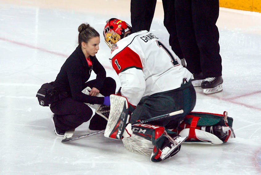 Halifax Mooseheads athletic therapist Robin Hunter tends to goalie Alexis Gravel during a Jan. 27, 2019 QMJHL game at the Scotiabank Centre. (ERIC WYNNE/The Chronicle Herald)