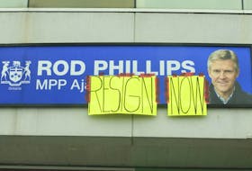 Homemade signs were taped to signage outside the plaza on Rossland Rd. West in Ajax where former Ontario Finance minister Rod Phillips has his constituency office. Phillips though is said to be staying on as the MPP for the region on Sunday January 3, 2021.