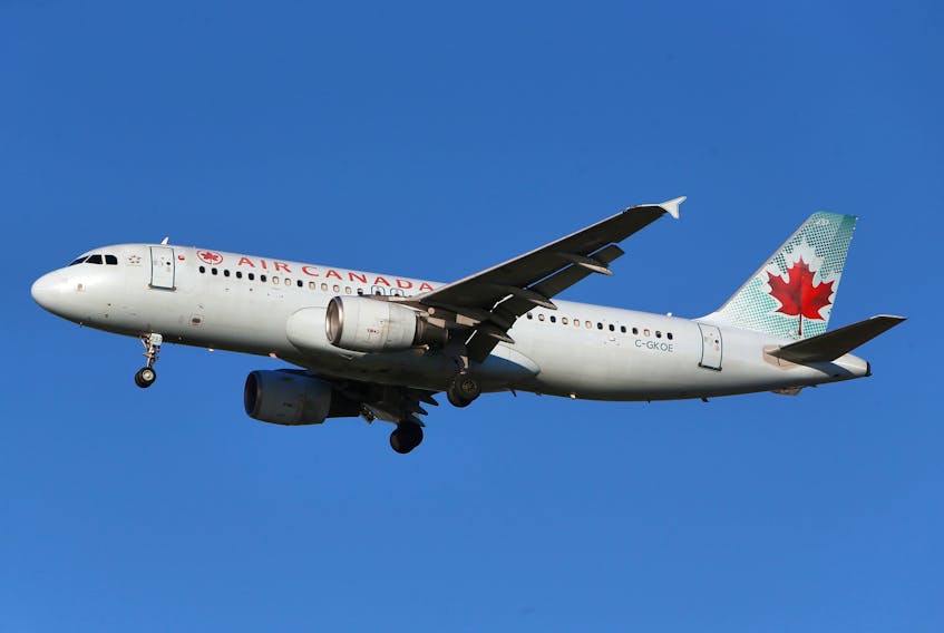 Air Canada said Wednesday it will cut first-quarter capacity by an additional 25 per cent, resulting in a workforce reduction of about 1,700 employees, as travel restrictions, lockdowns and new testing requirements to combat the spread of COVID-19 hit bookings. REUTERS/Ben Nelms/File Photo