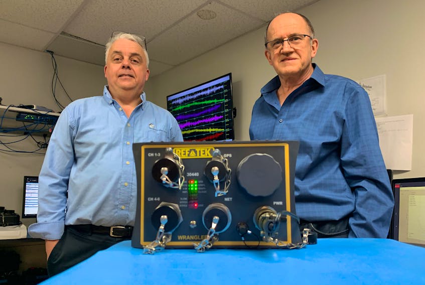 Derek Inglis, CEO of Reftek, and Gareth Hoar, chief technology officer, with a Wrangler seismic recorder at their Burnside facility on Thursday, Jan. 28, 2021.
