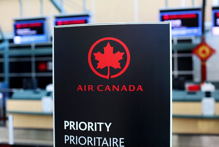 Air Canada check-in signage at Vancouver's international airport in Richmond, B.C. REUTERS/Ben Nelms/File Photo
