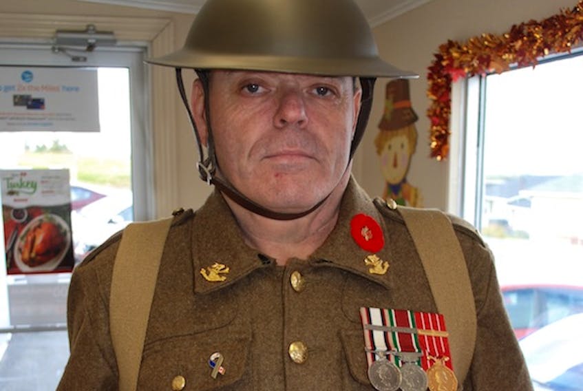 Retired veteran Roger Snook donned a First World War uniform to sell poppies at Arnold's Cove during Remembrance Week.
