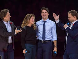 Co-founders Craig, left, and Marc Kielburger introduce Prime Minister Justin Trudeau and his wife Sophie Gregoire-Trudeau at a WE Charity event in Ottawa in 2015. POSTMEDIA