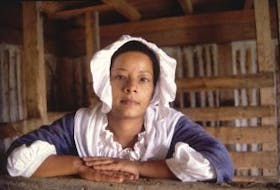 ['Charlene (Missy) Kirton, a Cape Bretoner and Park Canada interpreter, portrays Marie Marguerite Rose, an enslaved woman who eventually was freed in Louisbourg after 19 years slavery. In 1738, at the age of 21, Marie Rose gave birth to a son, Jean Francois, who became a slave. The father was listed as “unknown” but slaves were often sexual victims of their owners.']