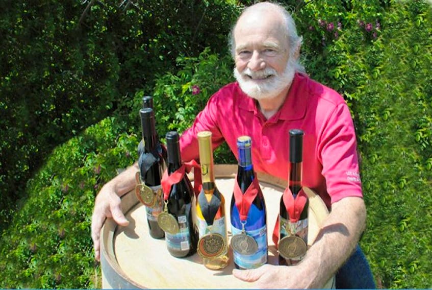 P.E.I. winemaker John Rossignol with his medal winners at the Little Sands winery.