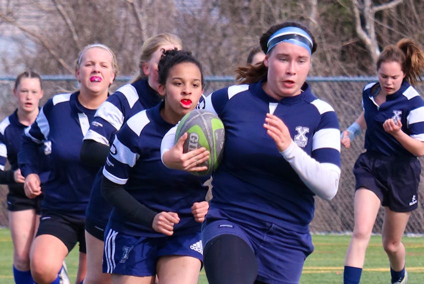 Co-captain Jessica MacKinnon leads her Dr. John Hugh Gillis Regional Royals up the field during a recent Northumberland region rugby match versus the Northumberland Nighthawks. Gail MacDougall