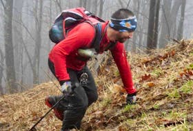 Jodi Isenor admits he’s more in his element when running trails in the backcountry. But the 45-year-old, shown here making his way up a hill called the Rat Jaw during the recent Barkley Marathon’s 100-mile trail race in Tennessee, will soon be hitting the road in hopes of running around Cape Breton’s scenic Cabot Trail to raise funds for the Make-A-Wish Foundation. Contributed/John Price