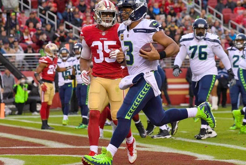 Seahawks quarterback Russell Wilson (3) scores on a 2-yard touchdown run against the 49ers during NFL action at Levi's Stadium in Santa Clara, Calif, on Nov. 26, 201.
