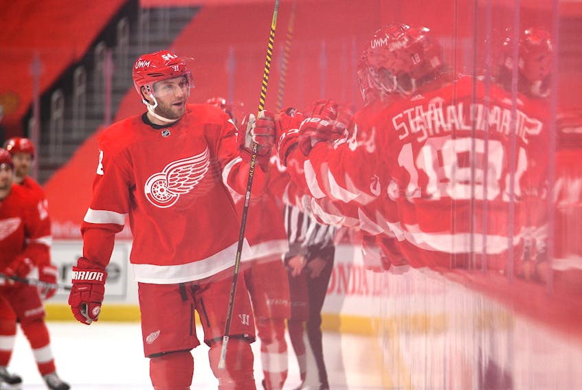 Detroit Red Wings forward Bobby Ryan is congratulated by teammates after scoring a goal against the Columbus Blue Jackets on Monday. Ryan scored both goals in Detroit's 3-2 loss.