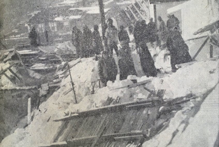 Debris from several homes is visible in this photo taken in the Outer Battery following an avalanche. — TELEGRAM FILE PHOTO