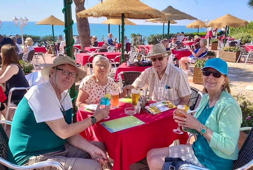 Marian and Russell Durling of Malagash (in the middle) sit with friends in Malaga, Spain. They were like countless other Canadians who had to leave Europe and return to Canada as a result of restrictions brought on by COVID-19. Contributed