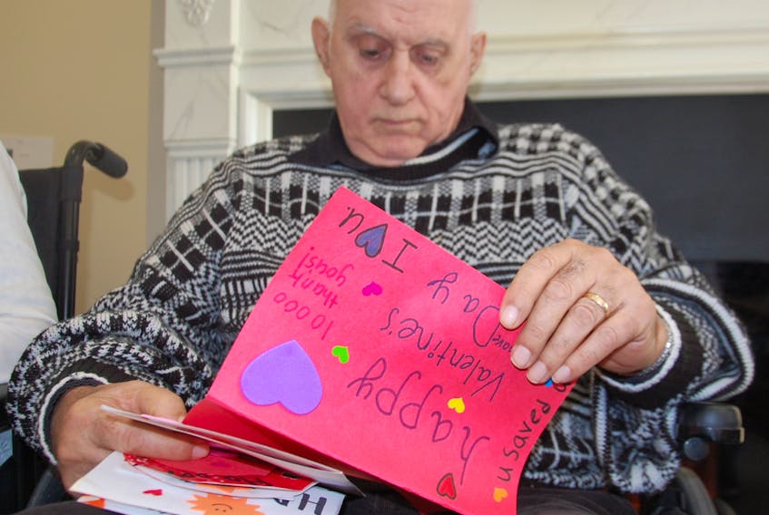 Roy MacNeill, a veteran who lives in the Garden Home in Charlottetown, was deeply touched to receive Valentine's Day cards hand-delivered by sailors from HMCS Charlottetown. The cards, which were made by Stratford Elementary students, were delivered Friday to veterans in several long-term care facilities on P.E.I. JIM DAY/THE GUARDIAN