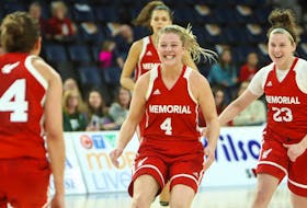 In this file photo from the 2018-19 AUS women’s basketball season, guards Jane Baird (4) and Haille Nickerson (23) celebrate a win with their Memorial Sea-Hawks teammates. This weekend, Baird and Nickerson play their last home games with the playoff-bound Sea-Hawks, who take on the UPEI Panthers tonight and Saturday at the Field House in St. John’s. The matchups will decide which team gets a bye through the first round of the AUS championship tournament. — Photo via Memorial Athletics