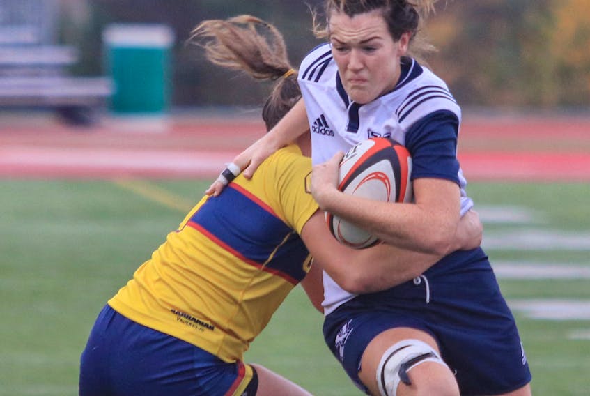 Sarah McCarron tries to break a tackle against the Queen’s Gaels during the 2018 U Sports rugby national championship game tournament. Gary Manning