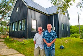 Fraser Hill (left) and Vincent Fraser-Hill in front of their Valley Mills, Cape Breton house they call Taigh Dubh (dark house).
Ryan Taplin - The Chronicle Herald