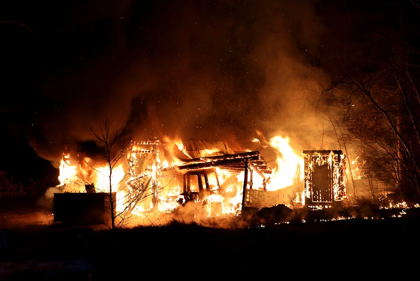 This Boxing Day blaze destroyed a building and the contents stored within it, including four tractors, at a wood-splitting operation along Highway 1 in Cambridge Dec. 26. - Adrian Johnstone photos