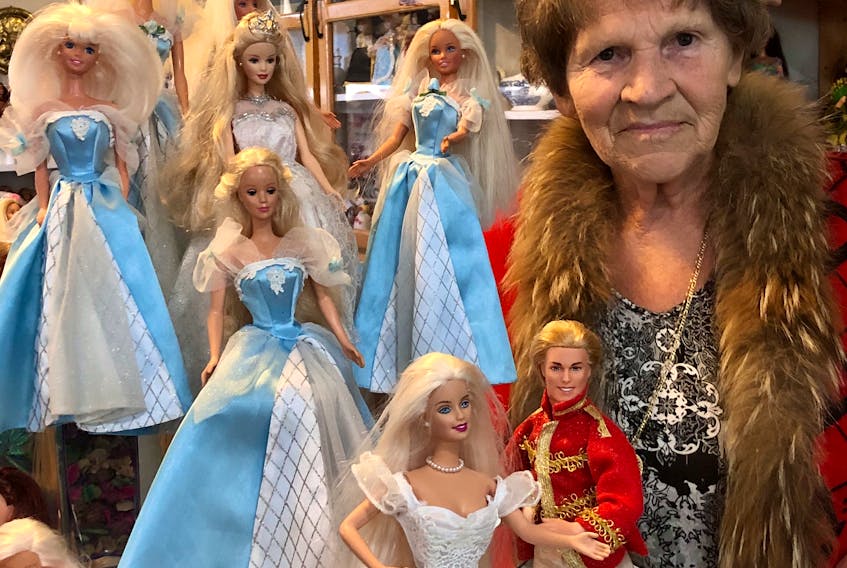 Madonna Porter poses with some of the dolls in her extensive Barbie collection on July 10, 2020 — two days before giving the collection to Branch 1 of the Royal Canadian Legion to be sold as a fundraiser. Porter, who made headlines with her charitable gesture, passed away Jan. 25.