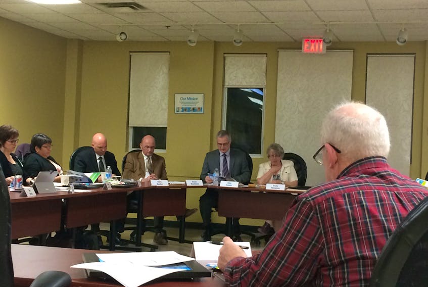 Trudy Thompson, chair of the Chignecto-Central Regional School Board, right, chairs the board’s final meeting Thursday. She is seated beside Superintendant Gary Adams, to her left, who will continue on with his staff to govern education in Pictou, Colchester and Cumberland