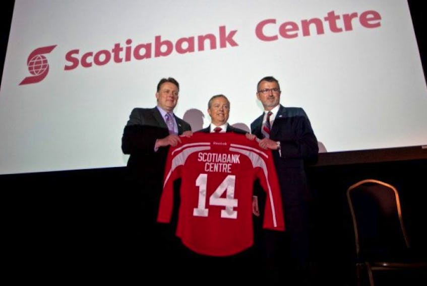 Mayor Mike Savage, left, Craig Thompson, Scotiabank senior vice-president of Atlantic Region and Scott Ferguson, president and CEO of TCL unviel the Scotiabank Centre logo. &nbsp; &nbsp; &nbsp; &nbsp; &nbsp; &nbsp; &nbsp; &nbsp;