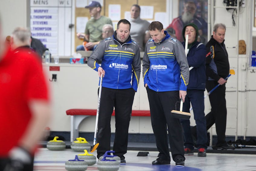 Skip Jamie Murphy, left, and third Paul Flemming talk strategy during   action at the 2020 Nova Scotia Men’s Provincial Championships at the Dartmouth Curling Club on Jan. 20, 2020.
ERIC WYNNE/Chronicle Herald
