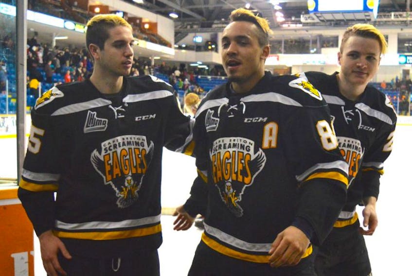 Cape Breton's Massimo Carozza, Michael Joly and Duncan MacIntyre make their way off the ice surface following the Screaming Eagles 5-2 win over the Chicoutimi Saguenéens on Saturday at Centre 200. The trio were named the game's three stars. The best-of-seven opening-round QMJHL playoff series is tied at one game each.