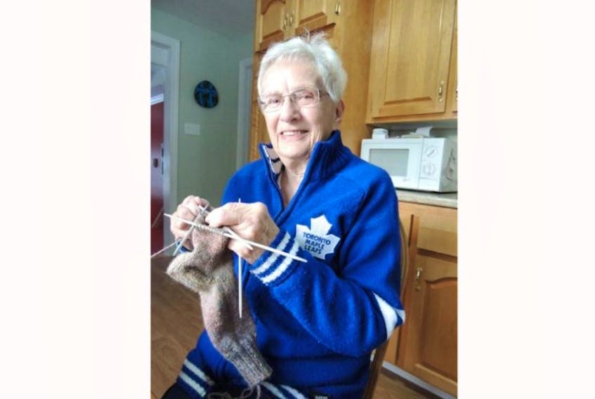 Audrey Chenell is busy knitting socks, having finished a dozen pairs of mittens for her teacher granddaughter to give out to kids who may have left home without any on winter mornings.