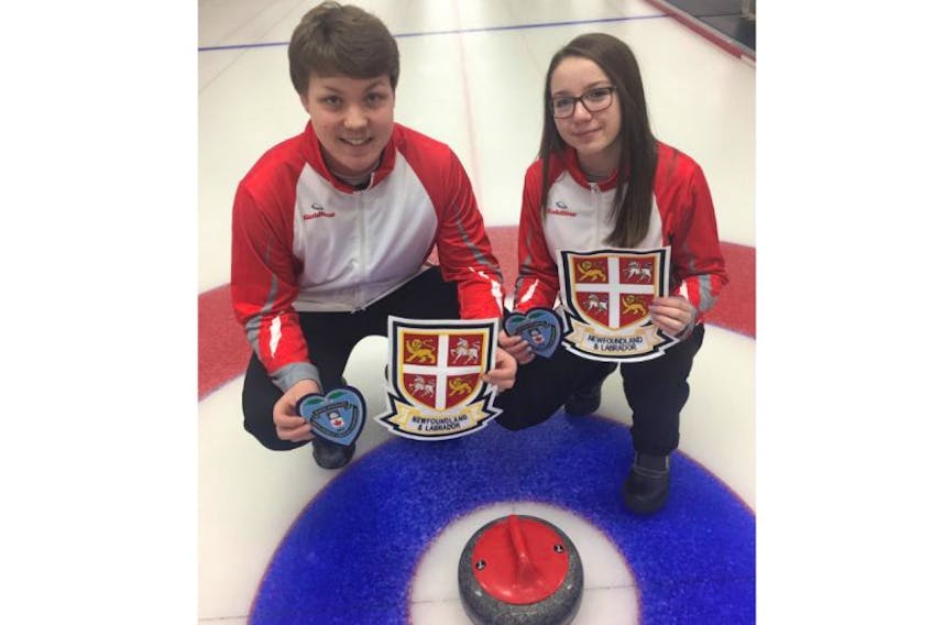 Ryan and Sarah McNeil Lamswood of the Caribou Curling Club pose for a team photo with their provincial crests after winning the 2017 provincial mixed doubles curling title.