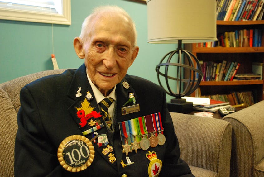 Chesley Bull sporting his 100th birthday button alongside his medals of service.
JONATHAN PARSONS/THE PACKET
