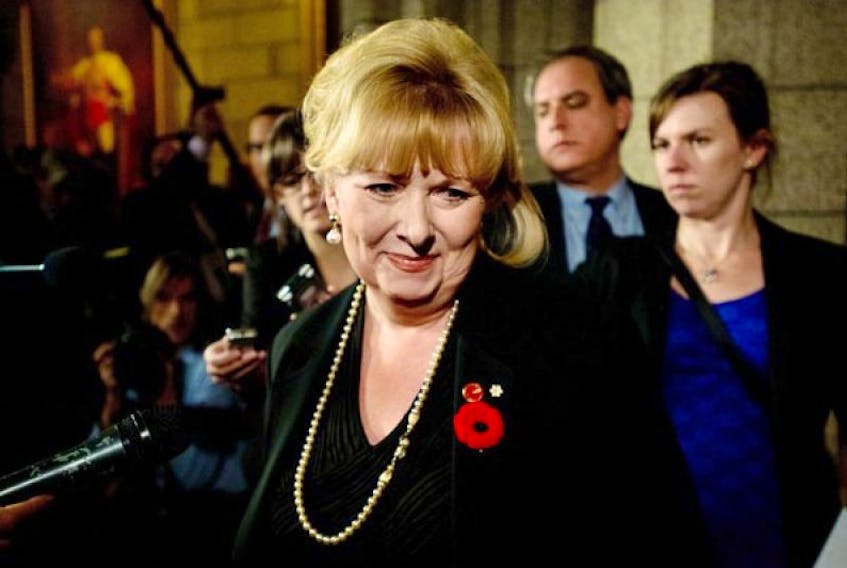 Senator Pamela Wallin leaves the chamber after the vote.