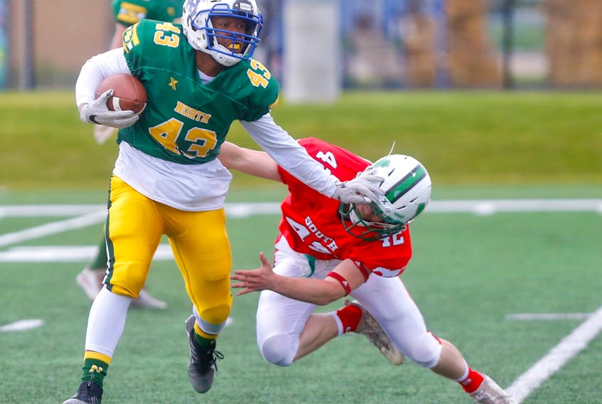 David Lezama of Team North battles Tanner Winter of Team South during Football Alberta's 30th annual Senior Bowl in Calgary in this file photo from May 20, 2019.