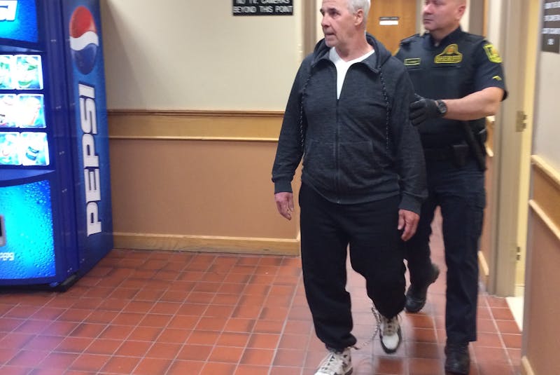 Dennis Murphy leaves a St. John's courtroom accompanied by a sheriff's officer June 17, 2019. - SaltWire Network File Photo
