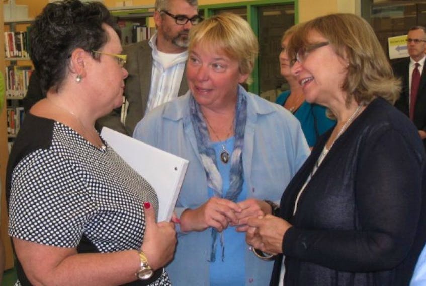 Community Services Minister Joanne Bernard, left, was in Kentville on June 16 to unveil the next stage of the province’s sexual violence strategy. She is shown in conversation with provincial advisor Dale Gruchy and NSCC Kingstec campus principal Isabel Madeira Voss.&nbsp;