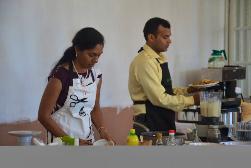 Dr. Arjun Rayapudi and Dr. Shobha Rayapudi prepare some plant-based recipes for people to sample during a workshop held Sept. 17. 