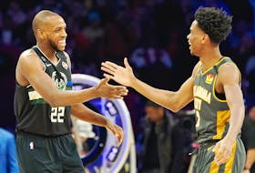 Milwaukee Bucks forward Khris Middleton (left) and Canadian Shai Gilgeous-Alexander of the Oklahoma City Thunder are all smiles during the NBA all-star skills challenge on Saturday night at Chicago’s United Center. (USA TODAY SPORTS PHOTO)