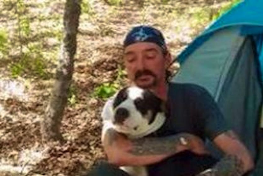 ['Shawn Kurtis Jack is shown above with his dog, Chico. The 48-year-old homeless man was savagely beaten in his campsite behind the Superstore in North Sydney in 2014. Charges were dropped on Monday against the last of six accused,&nbsp;Cory Patrick Richard Blinkhorn, 24, of North Sydney.<br /><br />']