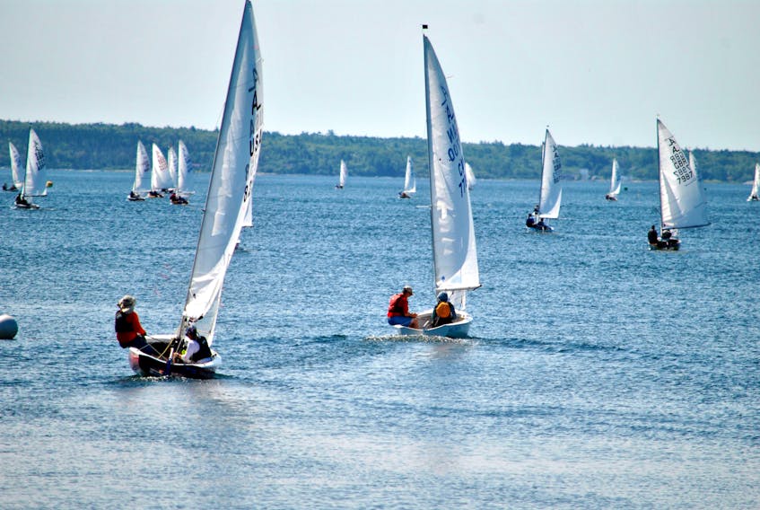 Sailors head out Shelburne Harbour for the first set of races in the 2019 International Albacore Championship regatta.  Hosted by the Shelburne Harbour Yacht Club the Albacore International Championship has been named Regatta of the Year by Sail Canada.  KATHY JOHNSON

