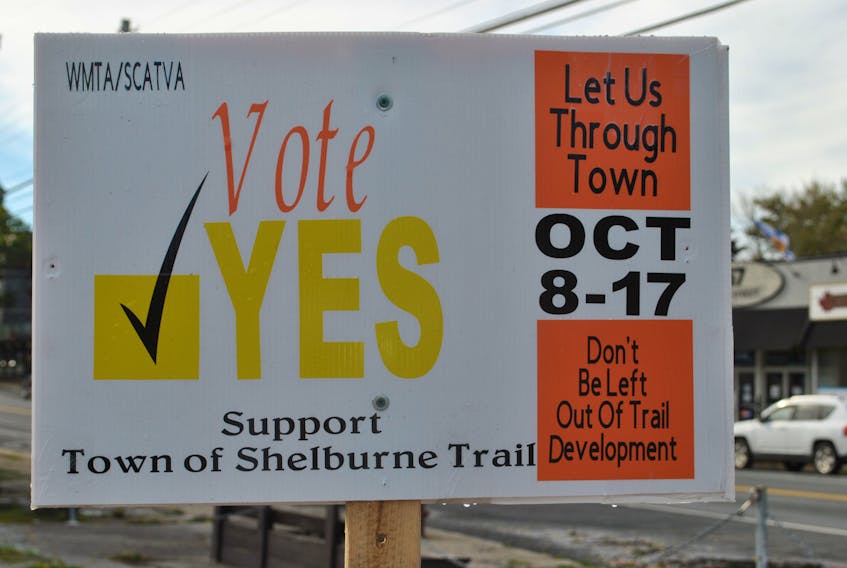 Signs promoting a yes vote on the plebiscite question on the ballot in the Town of Shelburne, Should the rail trail as it passes through town be open to off-highway vehicles?, outnumber the candidates signs  posted through town.