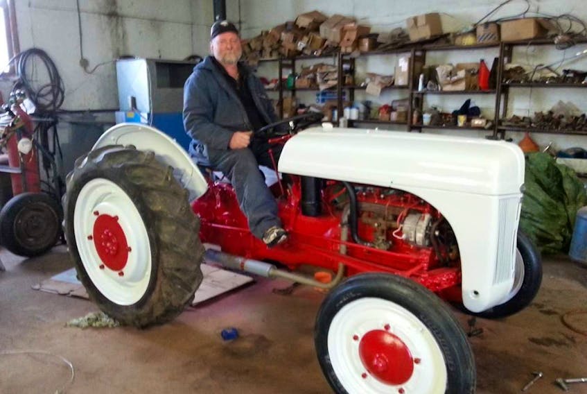 The late Joe King loved his vintage tractor. It was given to him by his friend Douglas MacAulay. He restored it with help from his uncle Eldrige King. CONTRIBUTED