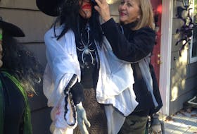 Bonita Gouthro spends time fussing over the witches, ghosts and goblins that make up her popular Halloween display on Johnson Road in Georges River. CONTRIBUTED