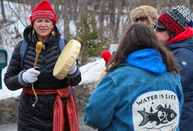 Messages, such as ‘water is life,’ were prevalent during a gathering of solidarity with Wet’suwet’en land defenders on Highway 104 in Auld’s Cove Saturday afternoon. Corey LeBlanc 