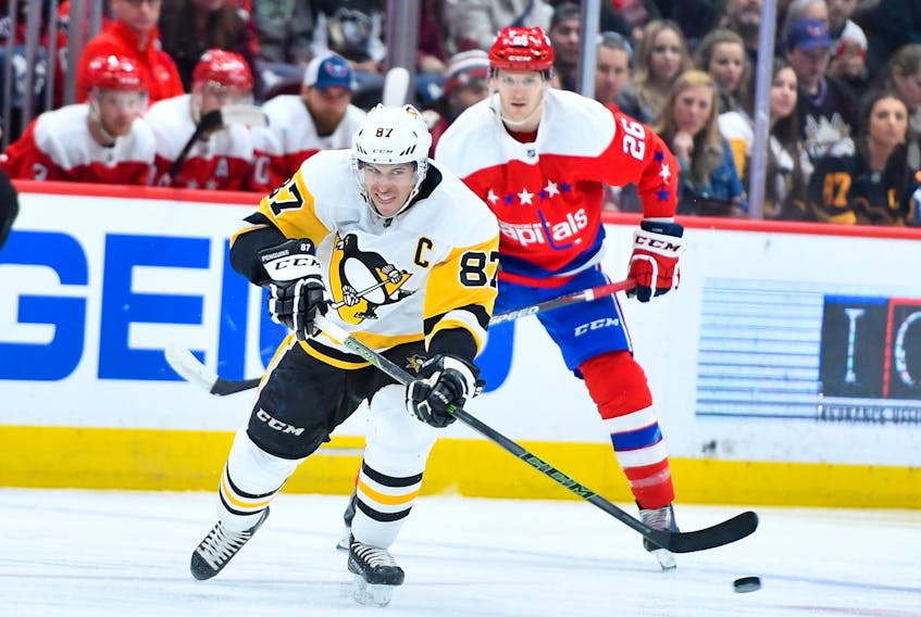 Pittsburgh Penguins captain Sidney Crosby passes the puck during a Feb. 2, 2020 NHL game against the Washington Capitals. (BRAD MILLS/USA Today Sports)
