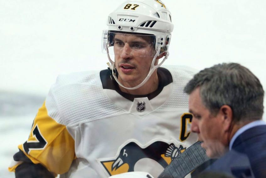 Penguins captain Sidney Crosby at his bench during a break in NHL action against the Jets in Winnipeg on Oct. 13, 2019.