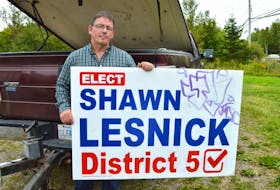 Shawn Lesnick, District 5 candidate for the upcoming Cape Breton Regional Municipality election, holds one of his signs he found vandalized. Lesnick said he has found a sign in Wentworth creek and others have gone missing but he won’t let it get him down. Sharon Montgomery-Dupe/Cape Breton Post
