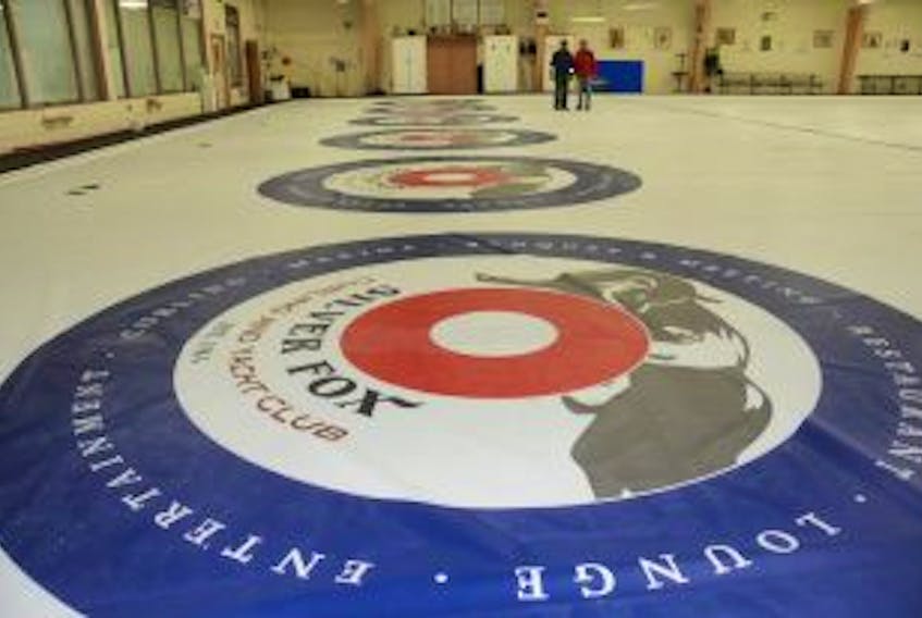['<p>Volunteers help to install a new reusable marking system at the Silver Fox Curling and Yacht Club. The investment will eliminate the need for painting the ice. Colin MacLean/Journal Pioneer</p>']