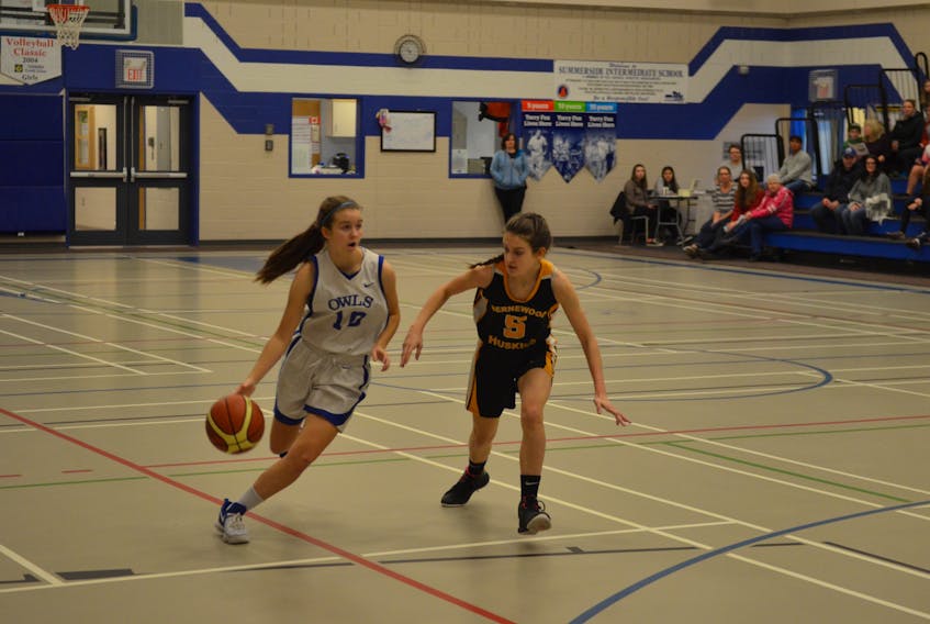 The Summerside Intermediate School Owls’ Paige MacLean, 10, looks to drive to the basket while Grace Peters defends for Hernewood. The action took place during the 41st annual SIS tip-off basketball tournament on Saturday morning.