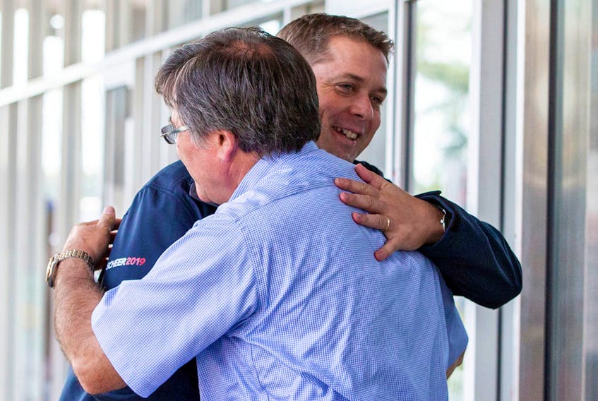 Leader of Canada's Conservatives Andrew Scheer greets Conservative candidate Costas Menegakis, as he campaigns for the upcoming election in Toronto, Ontario, Canada, September 18, 2019.  