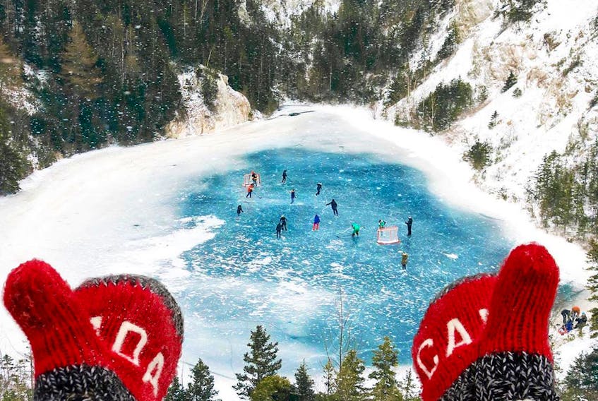 One of Davey and Sky's most popular snapshots is a group playing hockey on a man-made lake at the site of an old gypsum quarry in Cheticamp. CONTRIBUTED 