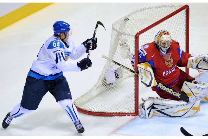 Finish hockey player Mikael Granlund scores a highlight-reel goal on Russian netminder Konstantin Barulin during the semifinal match of the World Hockey Championships in Bratislava, Slovakia, in this photo from May 2011.