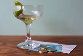 In a photo illustration, a tip is left behind with a finished drink at Field Guide in Halifax, N.S. on Wednesday, March 4, 2020.